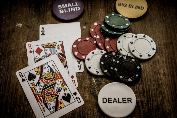 Live baccarat dealer dealing cards at Evolution Singapore